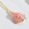 Exquisite pink enamel egg pendant necklace with intricate gold engraving and crystals - Rose Red