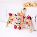 Sparkling crystal rhinestone cartoon bat keychain with gold metal base and pink gemstones - Pink