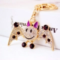 Sparkling crystal rhinestone cartoon bat keychain with gold metal plating and purple accents - Purple
