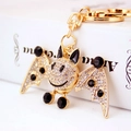 Sparkling crystal bat keychain with gold-plated metal base and white rhinestones - Black