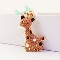 Schattige giraffe sleutelhanger met oranje strass steentjes en gouden afwerking - Individuele Verpakking / Perzik