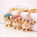 Golden elephant keychain set with opalite body and colorful sparkling rhinestones - Random Color
