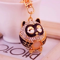 Cute cartoon owl keychain with white rhinestones and orange-pink gem in gold plating - Black