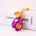 Porte-clés créatif sac porte-bonheur en strass violets avec placage d'or et symbole Cai - Violet