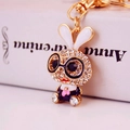 Cute cartoon rabbit keychain with sparkling rhinestones and black glasses in golden finish - Individual Packaging / Black