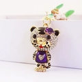 Funkelnder Sternzeichen Tiger Schlüsselanhänger mit lila Emaille-Herz und Goldfinish - Lila