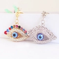 Porte-clés œil grec exquis avec strass colorés et perles de verre en or et en argent brillant - Couleur Aléatoire