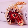 Sparkling red unicorn keychain with gold plating and white crystal rhinestones - Red
