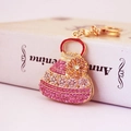 Elegante portachiavi a forma di borsa con strass e dettaglio floreale in rosa e oro - Rosa