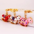 Sparkling rhinestone carousel horse keychains in red, white, and pink for women - Random Color