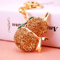 Portachiavi a forma di zucca dorata con strass ambrati e dettagli in smalto verde - 12.5x4.2cm / Oro