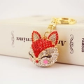 Sparkling fox keychain with red and white crystals and golden clasp on white background - Individual OPP Bag Packaging / Red