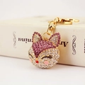 Sparkling fox keychain with purple crystals and pearl accents on a white book base - Individual OPP Bag Packaging / Purple
