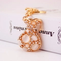 Golden money bag keychain with white opal and sparkling rhinestones for handbags - Money Bag Style (YS497) / Gold