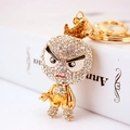Sparkling rhinestone cartoon character keychain with golden finish for women bag charm - Gold