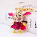 Porte-clés cochon volant scintillant avec strass roses et finition en métal doré - Rose