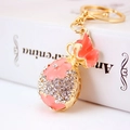 Porte-clés doré étincelant avec fleur en émail rose et pendentif sac de bijoux - Rose