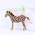 Cute golden zebra necklace with black and white enamel and sparkling rhinestones - Zebra
