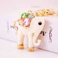 Elephant keychain charm featuring white textured resin with colorful crystal inlay - White