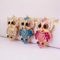 Porte-clés chouette chics avec strass colorés étincelants en finitions or, bleu et rose - Couleur Aléatoire