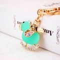 Sparkling crystal rocking horse mint duck keychain with golden alloy and rhinestones - Blue