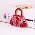 Portachiavi a forma di borsa con cristalli rossi e bianchi e finitura in oro lucido - Rosso