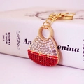 Exquisite handbag-shaped keychain with red and white sparkling crystals on gold metal - Red