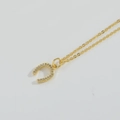 Golden horseshoe pendant necklace with pavé cubic zirconia on minimalist chain - Horseshoe Pendant (MA1-2)