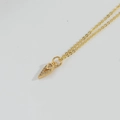 Golden necklace featuring a stylish anchor triangle pendant with micro-pave zircons - Cone (MA1-2)