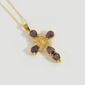 Golden cross necklace with purple drop gemstones and Virgin Mary relief in the center - Purple Zirconia