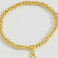 Elegant gold beaded stretch bracelet featuring a minimalist capital letter A pendant - Letter A