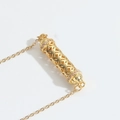 Hollow gold tube necklace with geometric pattern and purple crystal stone accents - Pink Zirconia
