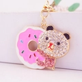 Cute rhinestone bear with pink donut keychain in gold-plated alloy for handbag charm - Pink