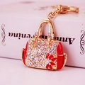 Portachiavi a borsa dorato con strass bianchi e smalto rosso per donna elegante - Rosso