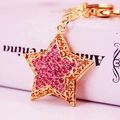 Cute golden star keychain with pink rhinestones and hollow-out design for bag pendant - Pink