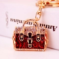 Portachiavi a borsa dorato con smalto leopardato rosso e strass luccicanti di lusso - Rosso