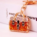 Portachiavi borsa dorata con smalto leopardato arancione e strass luminosi - Oro