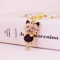 Golden cat keychain featuring sparkling white rhinestones and a large black gem detail - Solid Black