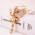 Golden ballerina angel keychain with sparkling crystals and a large colorful diamond gem - Iridescent