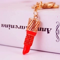 Creative gold lipstick keychain featuring red rhinestones and polished metal finish - Orange Red