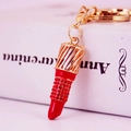 Creative red rhinestone lipstick keychain with golden metal ring and lobster clasp - Red