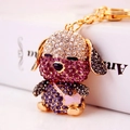 Llavero de perro de dibujos animados con pedrería de cristal lila y acabado en metal dorado - Peso 57.1g, Longitud 11.5*4.5CM / Morado