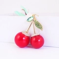 Sparkling cherry keychain with red spheres and green rhinestone leaves on gold stem - Red and Green Cherry