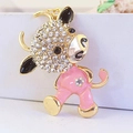 Pink enamel cartoon calf keychain with sparkling rhinestones and a gold metal finish - Peach