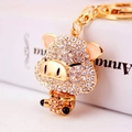 Portachiavi a forma di maialino in smalto rosa e strass champagne con gancio d'oro - Pesca