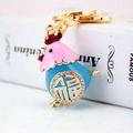 Portachiavi gallina smaltata rosa e blu con ciondolo 福 dorato e strass - Imballaggio Individuale / Blu