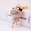Porte-clés singe en alliage doré avec émail lilas et strass blancs scintillants - Violet