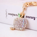 Portachiavi a forma di mela con strass brillanti e chiusura a moschettone dorata - Bianco