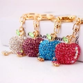 Diamond-encrusted apple keychains in four colors with gold metal links and crystals - Random Color
