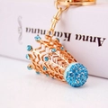 Luxury rose gold crown keychain with blue rhinestones on a vintage book background - Single Individual Package / Blue